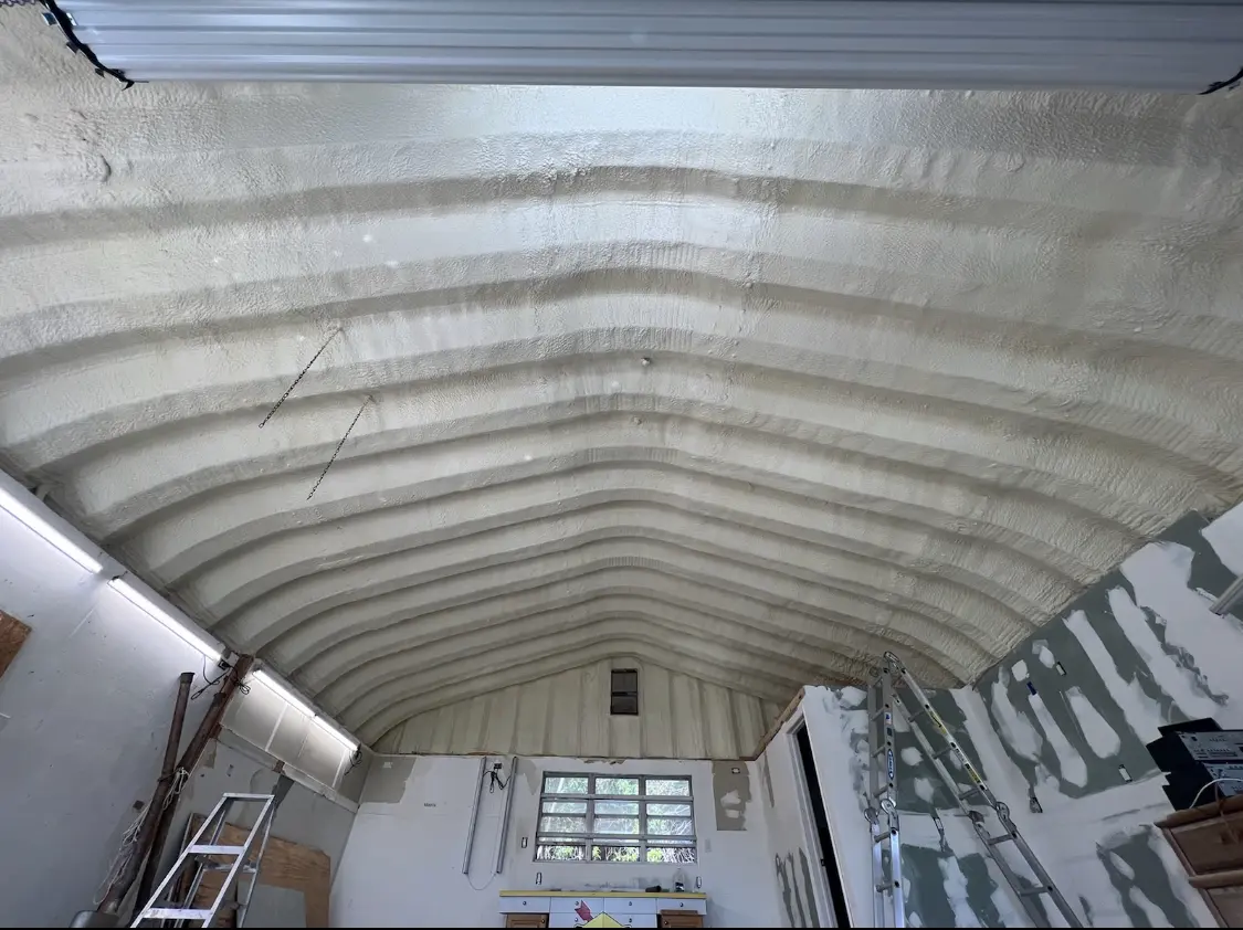 Spray polyurethane foam applied to the underside of a metal roof deck in Soquel